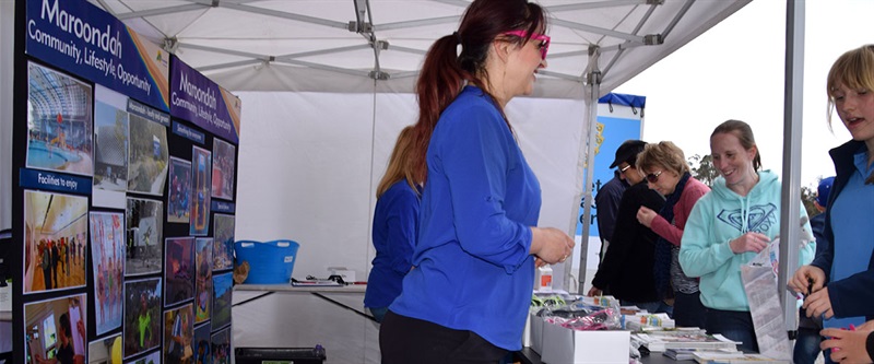 2 people from customer service assisting public queries at Maroondah Festival