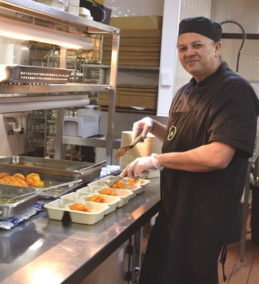 Staff preparing meals to be delivered to seniors.