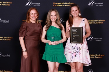 Mindful Living Counselling and Psychology award winners with trophy and certificate.