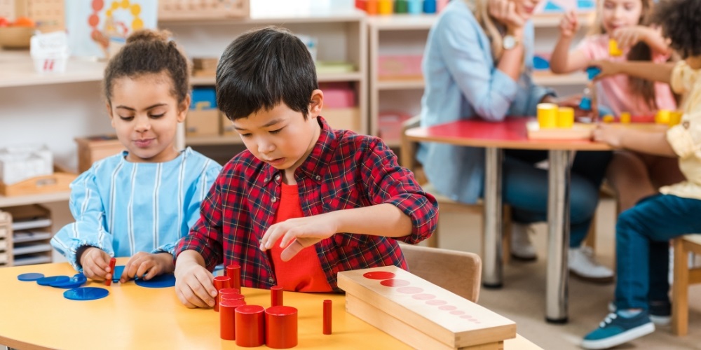 Young children engaging with coloured blocks