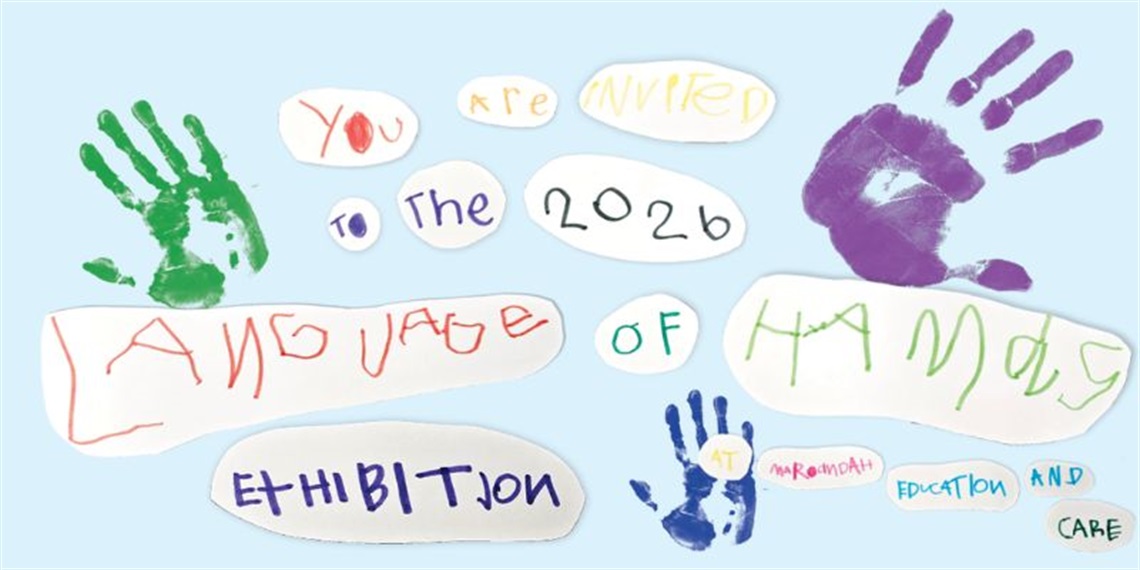 Children’s handprints and artwork inviting people to the Language of Hands exhibition.