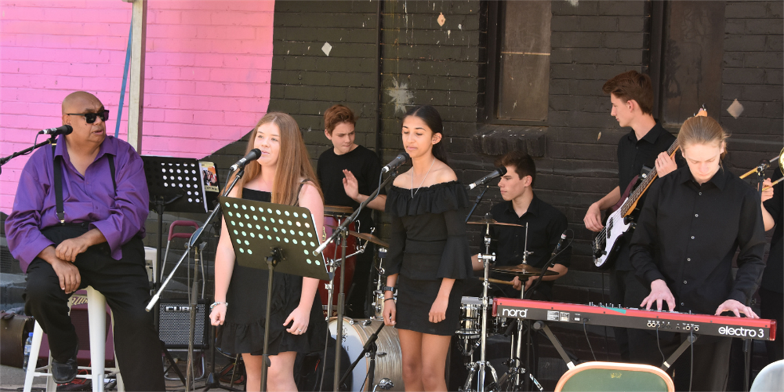 Kutcha and friends performing during Reconciliation Week