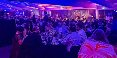 Guests enjoying entertainment as part of the Gala Dinner.