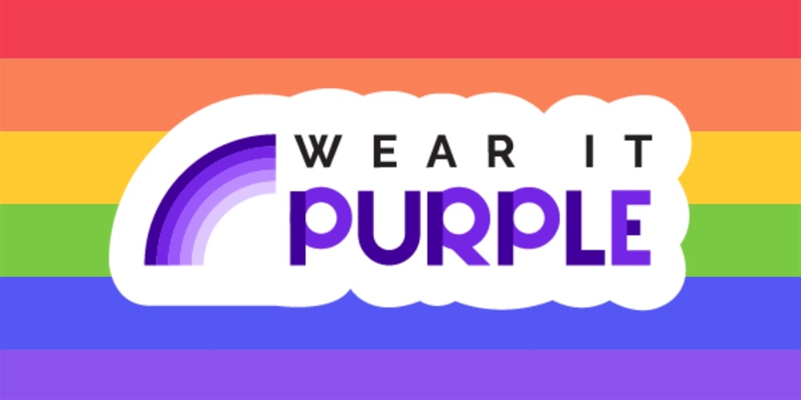 Wear it Purple logo over a rainbow background