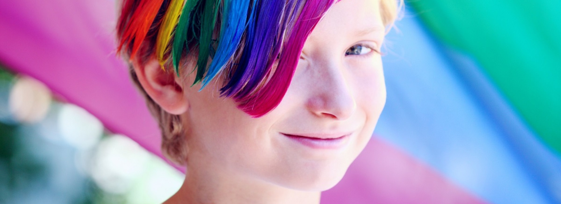 Young person with rainbow coloured hair
