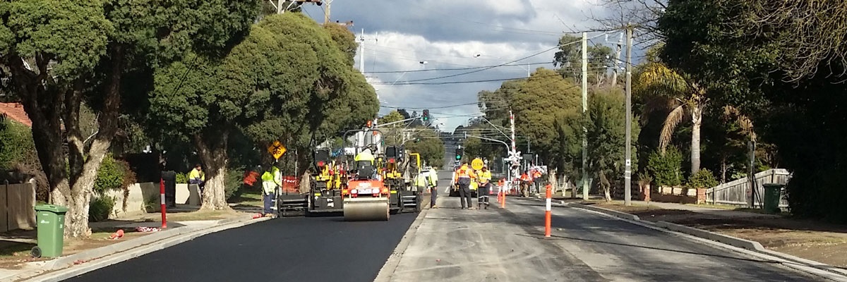 Works being completed using heavy machinery to a residential road