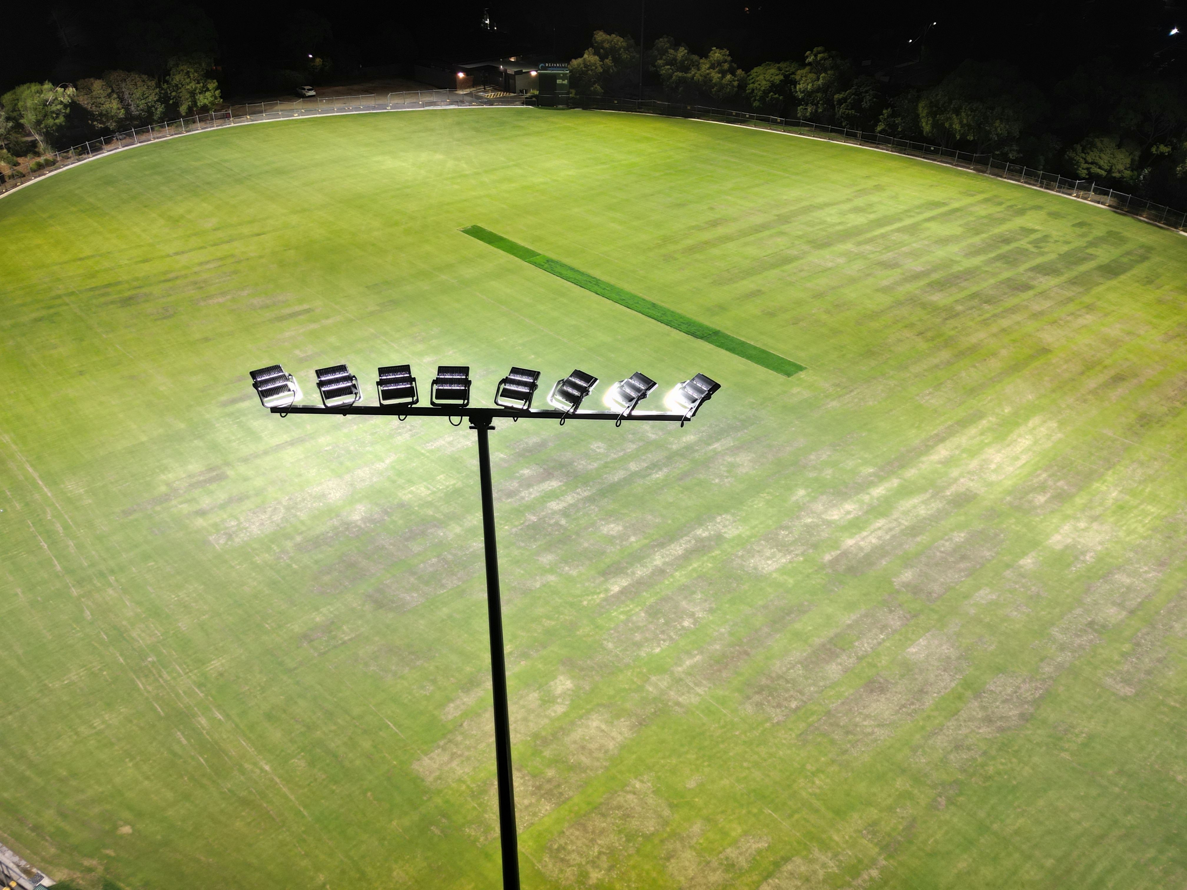 Drone view of North Ringwood Reserve at night with the new lights shining onto the ground