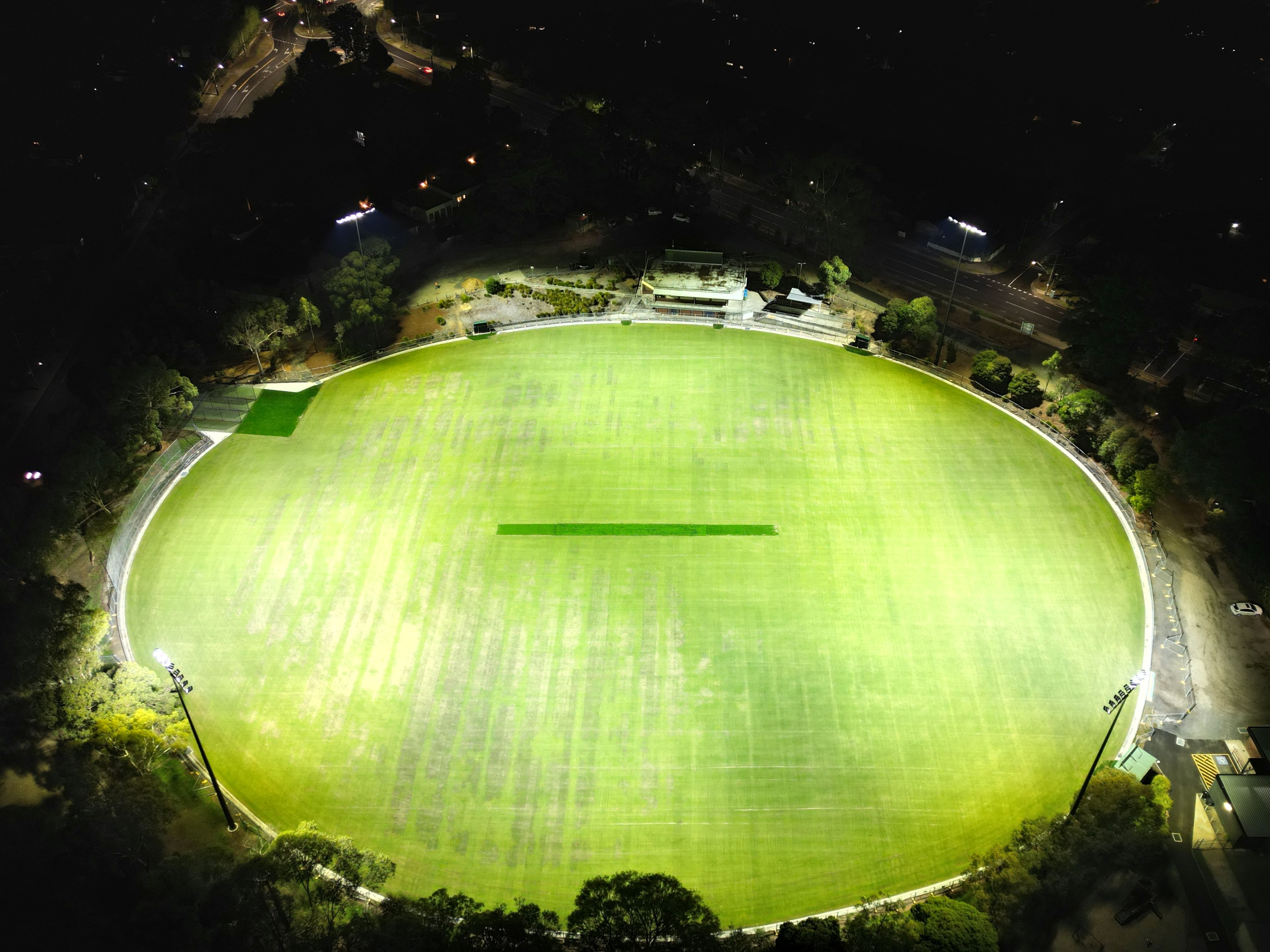 Drone view of North Ringwood Reserve at night with the new lights shining onto the ground