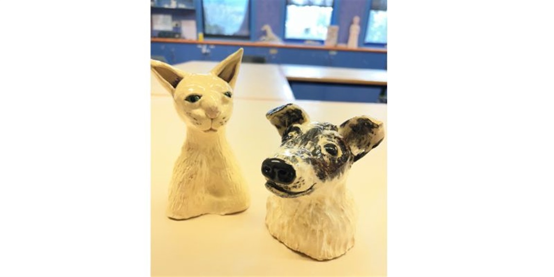 2 dog clay animals