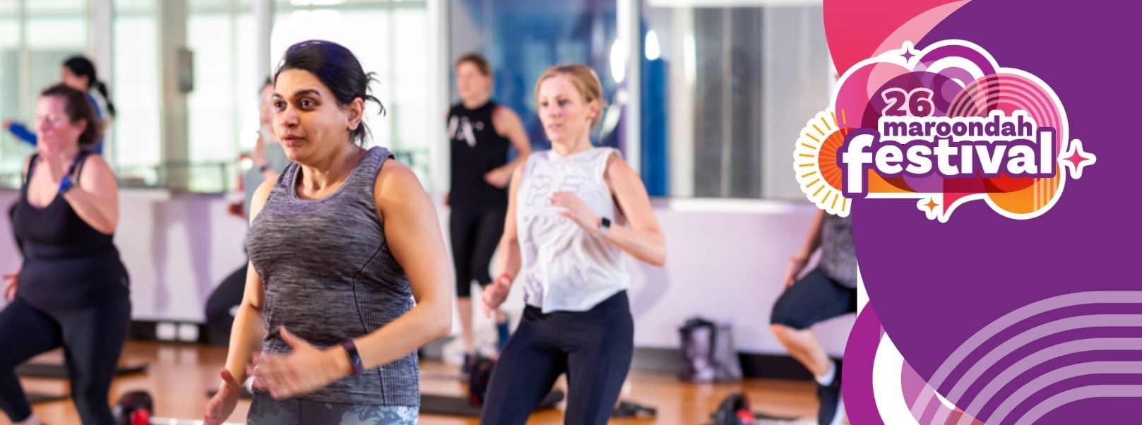 People participating in a group fitness class at an indoor gym or recreation facility. Several participants are exercising on a polished timber floor, with one participant in the foreground and others exercising in the background. The Maroondah Festival 2026 logo is displayed on a purple graphic panel on the right-hand side of the image. The image is used to promote a giveaway for a Maroondah Leisure Individual Fitness Plus Membership as part of the lead-up to Maroondah Festival 2026.