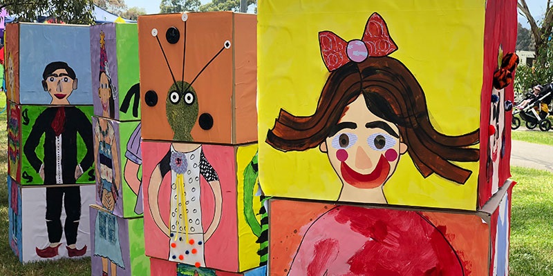 An interactive activity made up of large cardboard boxes with interchangable heads, bodies and legs drawn onto them so that participants can create their own unique people.