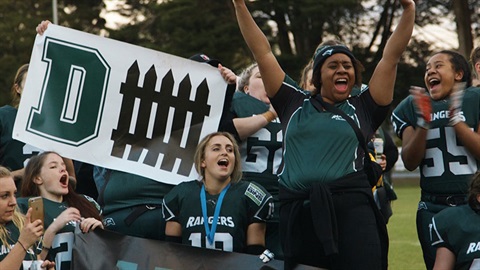 Women cheering for a women's sporting team