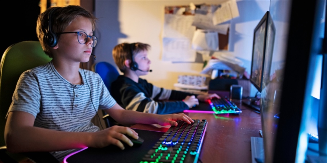 Two young people playing computer games