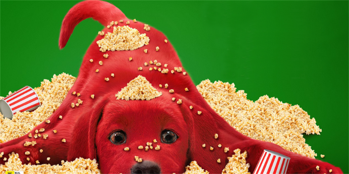Clifford the Big Red Dog covered in popcorn