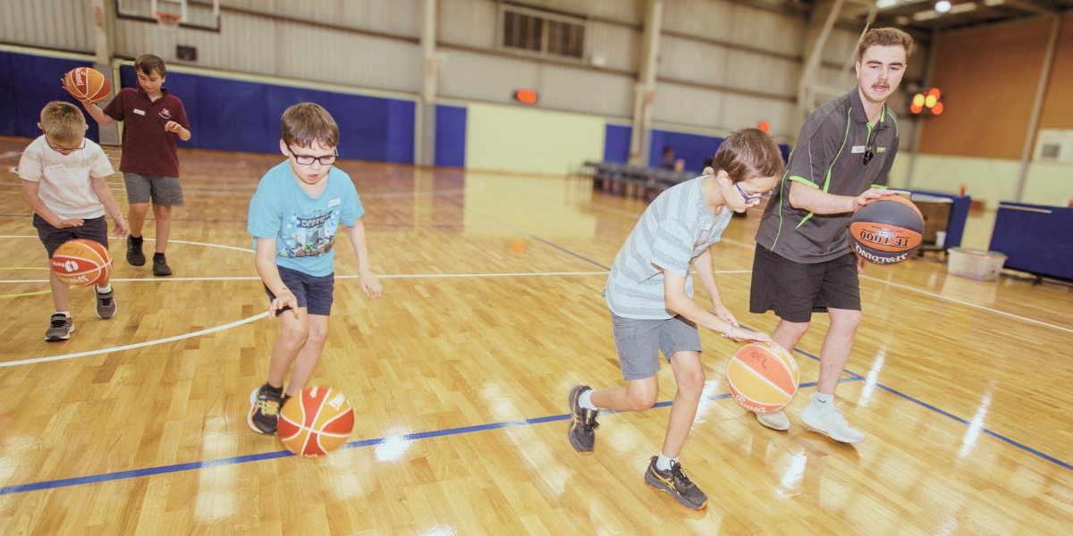 Children participating in the basketball program at The Rings