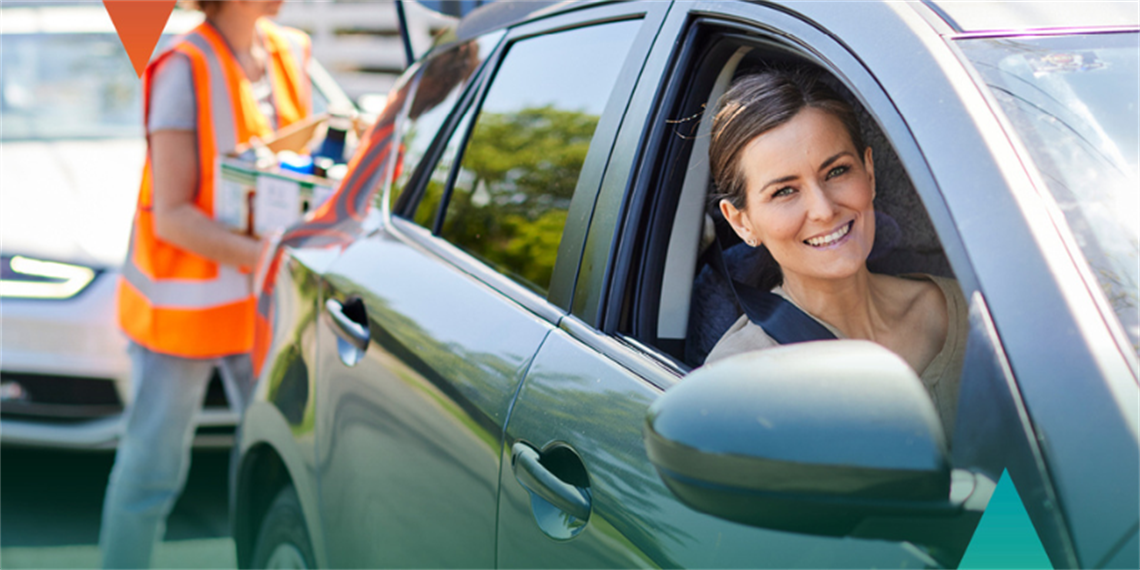 Woman in car with chemicals being taken out of her boot.png