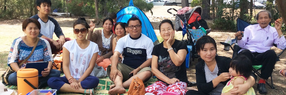 group of people at a festival or fete smiling at camera